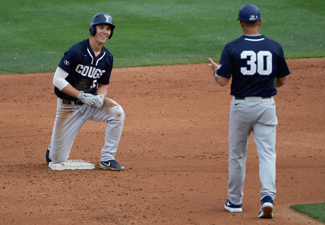 (Francisco Kjolseth  |  The Salt Lake Tribune)  BYU's Danny Gelalich takes a while on second base after his failed steal as Utah and BYU renew their rivalry on the baseball diamond as they battle it out at Smith's Ballpark in Salt Lake City on Tuesday, May 14, 2019.