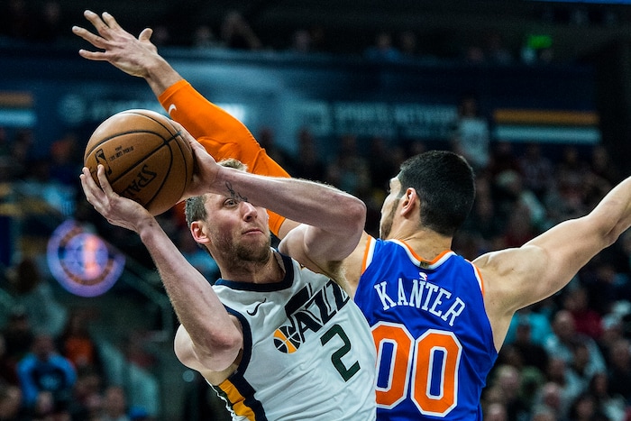 (Chris Detrick  |  The Salt Lake Tribune)  Utah Jazz forward Joe Ingles (2) passes around New York Knicks center Enes Kanter (00) during the game at Vivint Smart Home Arena Friday, January 19, 2018.  