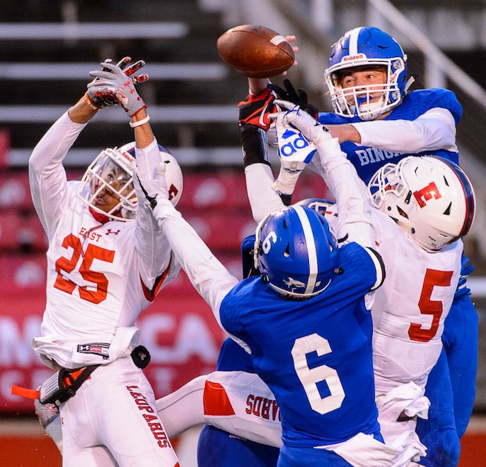 (Trent Nelson | The Salt Lake Tribune)  The ball goes over East's Christian Nash (25) late in the fourth quarter as Bingham defeats East in the Class 6A High School State Football Championship game in Salt Lake City, Friday November 17, 2017.