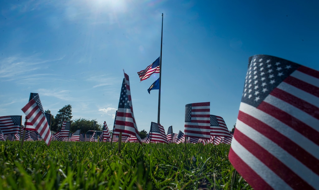 (Rick Egan  |  Tribune file photo) A display of 3,000 flags wave in the grass in front of Skyline High School in 2018, in memory of those who lost their lives on Sept. 11, 2001.