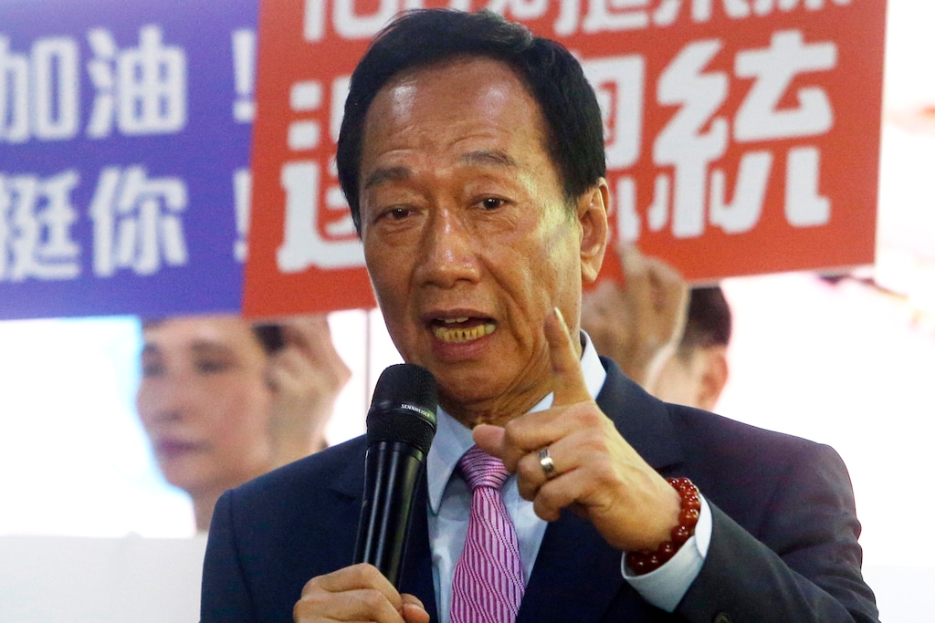 FILE - In this June 21, 2019, file photo, Terry Gou, chairman of Foxconn, the world's largest contract assembler of consumer electronics, speaks to the media after the company's annual shareholders meeting in New Taipei City, Taiwan. Gou has given up on making a bid for Taiwan's presidency. Gao announced his decision in a statement late Monday, Sept. 16, 2019, one day before a deadline to register for the race. (AP Photo/Chiang Ying-ying, File)