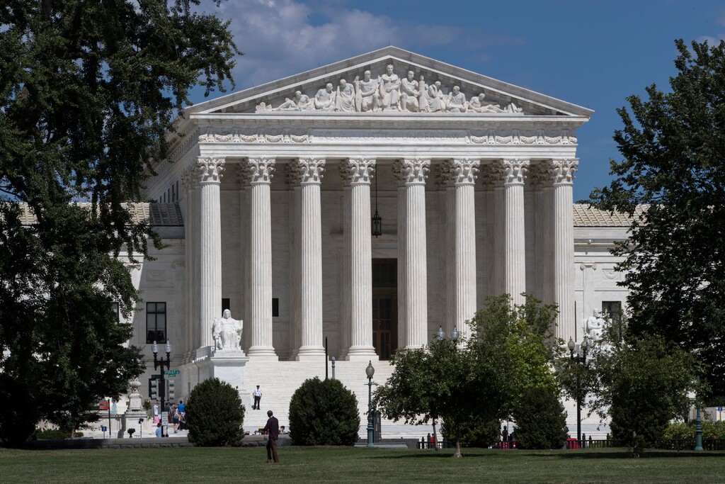 FILE - In this June 26, 2017, file photo, The Supreme Court is seen in Washington. Recent presidents have delighted in dramatically revealing the people they have chosen to sit on the Supreme Court. And they’ve gone to some lengths to keep their ultimate choice under wraps. Trump is expected on Monday to announce his choice to replace retiring Justice Anthony Kennedy. (AP Photo/J. Scott Applewhite, File)
