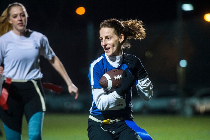 (Chris Detrick | The Salt Lake Tribune) Team A Lot's Leslie Hadfield runs the ball during the flag football team game against Sim Team at North University Fields in Provo Thursday, November 30, 2017.