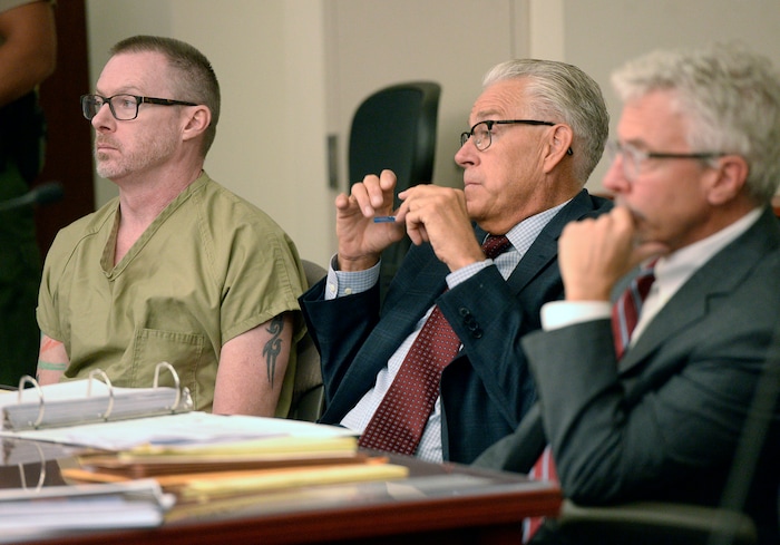 (Al Hartmann  |  The Salt Lake Tribune)       
Craig Crawford, left, sits with defense lawyers Jim Bradshaw and Mark Moffat in 3rd District Judge James Blanch's courtroom during a three-day sentencing hearing Monday August 28 in Salt Lake City.  Crawford has admitted that he trapped his 72-year-old estranged husband, well-known restaurateur John Williams, inside his home and then set it ablaze last year.
He pleaded guilty in June to first-degree felony counts of aggravated murder and aggravated arson.
The judge will decide whether Crawford will serve life in prison with or without the possibility of parole.