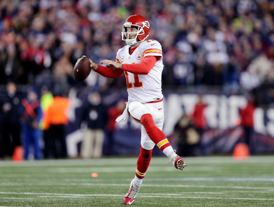 Kansas City Chiefs quarterback Alex Smith (11) looks for a receiver against the New England Patriots in the first half of an NFL divisional playoff football game, Saturday, Jan. 16, 2016, in Foxborough, Mass. (AP Photo/Charles Krupa)