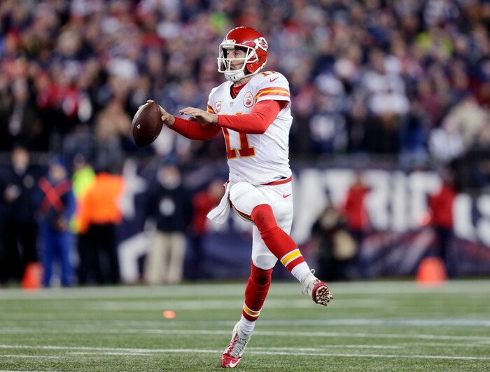 Kansas City Chiefs quarterback Alex Smith (11) looks for a receiver against the New England Patriots in the first half of an NFL divisional playoff football game, Saturday, Jan. 16, 2016, in Foxborough, Mass. (AP Photo/Charles Krupa)
