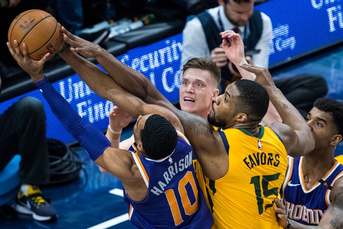 (Chris Detrick  |  The Salt Lake Tribune)  Phoenix Suns guard Shaquille Harrison (10) Utah Jazz forward Derrick Favors (15) Utah Jazz forward Jonas Jerebko (8) and Phoenix Suns forward Marquese Chriss (0) go for a rebound during the game at Vivint Smart Home Arena Thursday, March 15, 2018. 