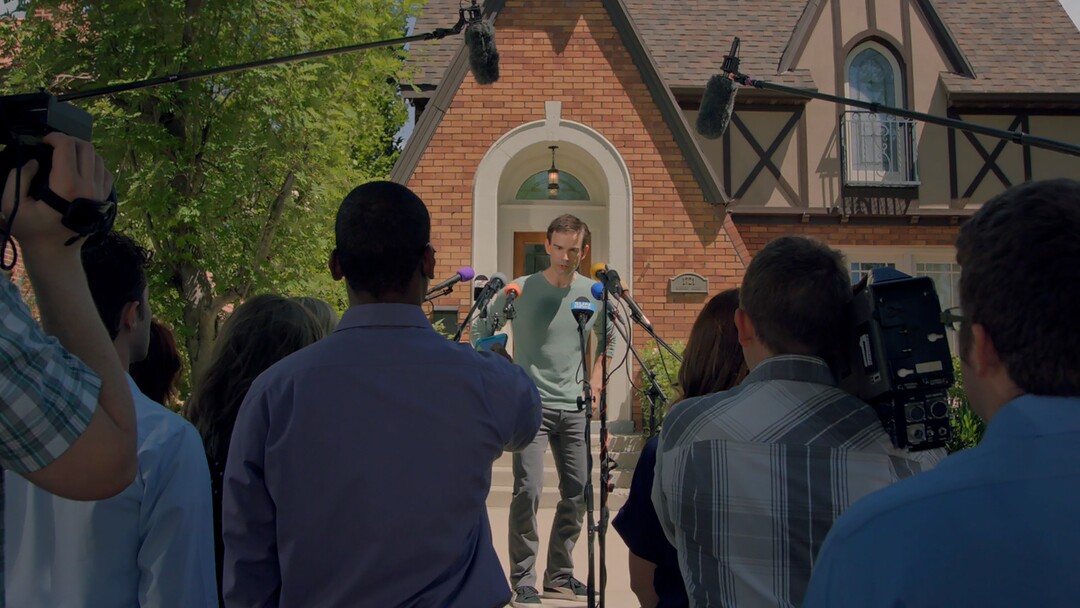 |  Purdie DistributionSimon (Christopher Gorham, center), an author hiding behind a pseudonym, faces the press when his cover is blown, in the romantic comedy "We Love You, Sally Carmichael!"