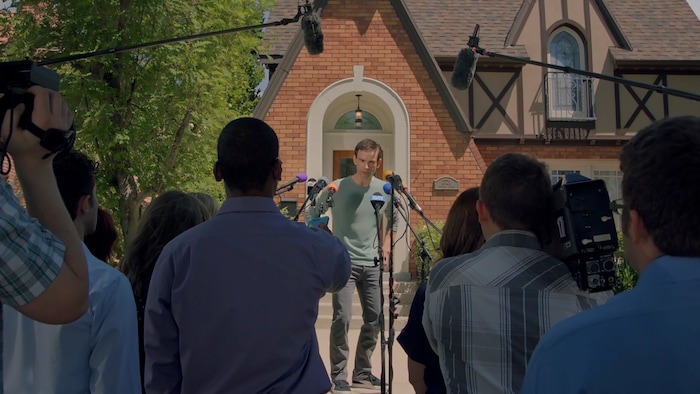 |  Purdie DistributionSimon (Christopher Gorham, center), an author hiding behind a pseudonym, faces the press when his cover is blown, in the romantic comedy "We Love You, Sally Carmichael!"