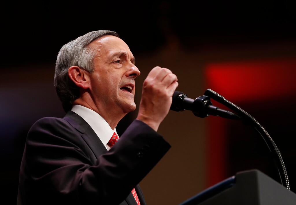 FILE - In this July 1, 2017, file photo, Pastor Robert Jeffress of the First Baptist Dallas Church Choir speaks as he introduces President Donald Trump during the Celebrate Freedom event at the Kennedy Center for the Performing Arts in Washington. A few of President Donald Trump’s leading evangelical supporters defended him after he questioned why the U.S. should accept more immigrants from Haiti and "shithole countries” in Africa. However, many other evangelicals condemned his remarks, citing their increasing devotion to fellow Christians overseas, along with the large numbers of immigrants in U.S. churches and their families.  (AP Photo/Carolyn Kaster, File)