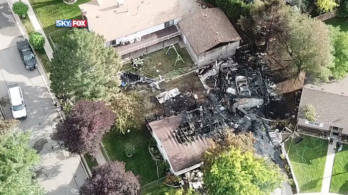 (Courtesy of FOX 13) An aerial view of the crash site where a small plane, carrying six passengers, struck a residential neighborhood in West Jordan on Saturday, July 25, 2020.