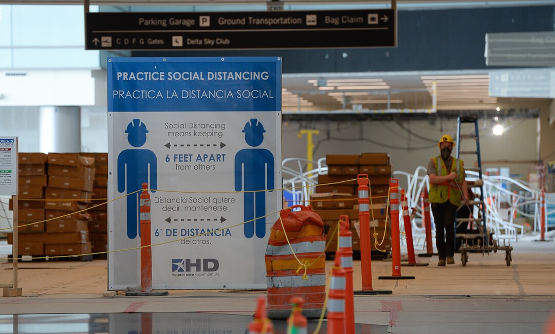 (Francisco Kjolseth  |  The Salt Lake Tribune) Signs encouraging social distancing are displayed due to the ongoing battle against COVID-19 as crews continue their work in the first phase of construction of the Salt Lake City International Airport on Wednesday, May 20, 2020.