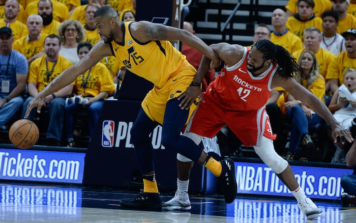 (Francisco Kjolseth | The Salt Lake Tribune) Utah Jazz forward Derrick Favors (15) gets the ball away from Houston Rockets center Nene Hilario (42) in the first half of Game 4 of the NBA playoffs at the Vivint Smart Home Arena Sunday, May 6, 2018 in Salt Lake City.