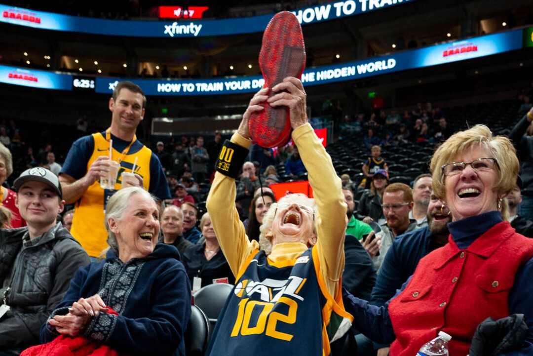 (Trent Nelson | The Salt Lake Tribune)  102-year-old Jazz fan Roberta Morgan holds up an autographed shoe given to her by Utah Jazz guard Donovan Mitchell (45) as the Utah Jazz host the Milwaukee Bucks, NBA basketball in Salt Lake City on Saturday March 2, 2019.