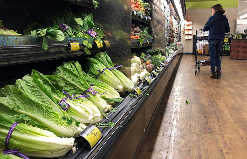 (Mark J. Terrill  |  AP Photo)  Romaine Lettuce still sits on the shelves as a shopper walks through the produce area of an Albertsons market Tuesday, Nov. 20, 2018, in Simi Valley, Calif. Health officials in the U.S. and Canada told people Tuesday to stop eating romaine lettuce because of a new E. coli outbreak.