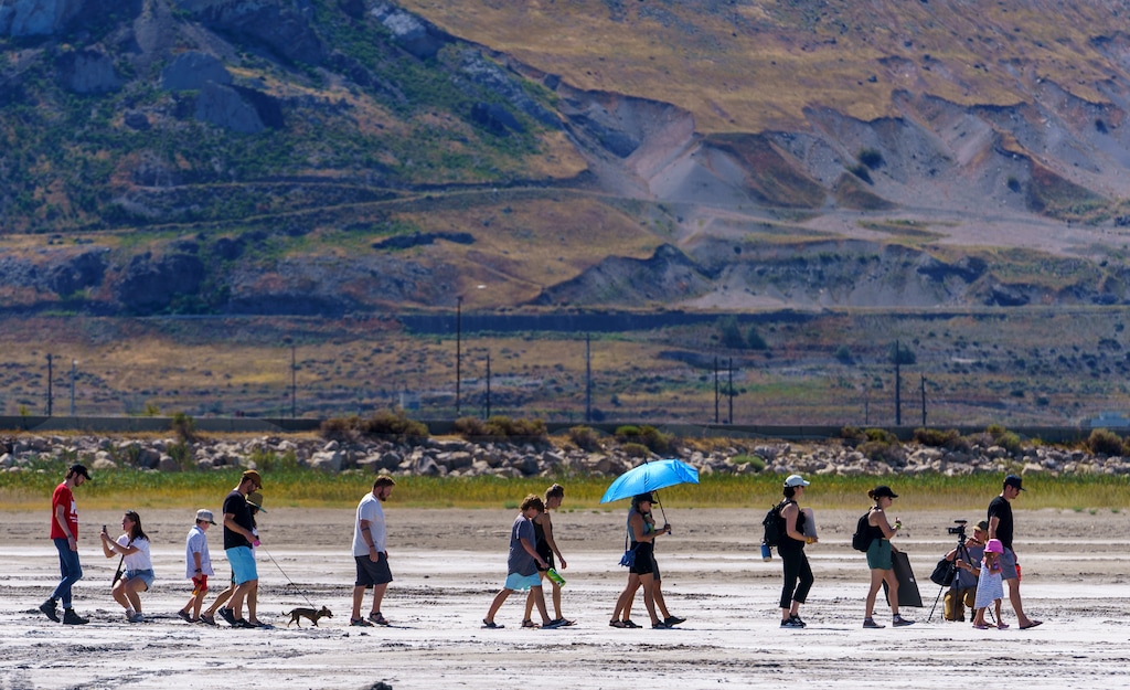 (Leah Hogsten | The Salt Lake Tribune) Members of Utah Youth Environmental Solutions Network (UYES) and concerned citizens staged a demonstration near Saltair, Sept. 3, 2022, to call for immediate action to protect the Great Salt Lake. A group is trying to make the lake part of the global rights of nature movement.