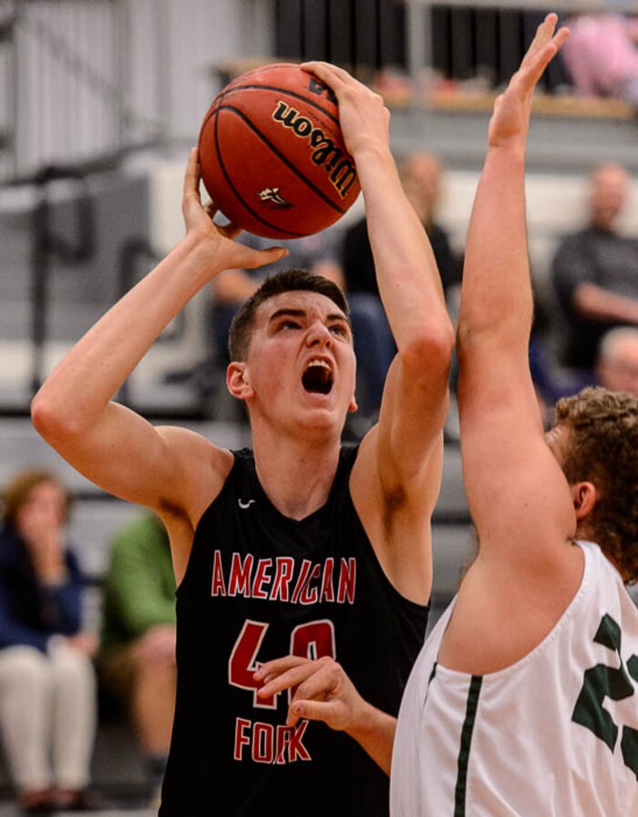 (Trent Nelson | The Salt Lake Tribune)  American Fork's Isaac Johnson shoots as American Fork hosts Olympus in the Utah Elite Eight tournament, Saturday December 9, 2017.