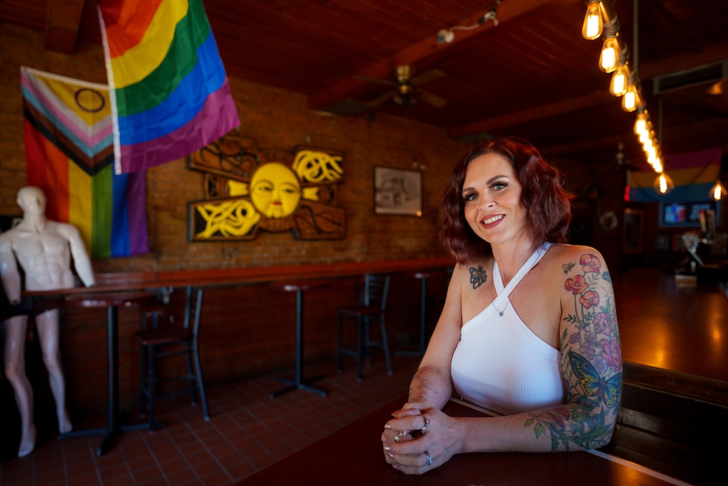 (Trent Nelson | The Salt Lake Tribune) Mary Peterson at The SunTrapp in downtown Salt Lake City on Friday, June 28, 2024. Peterson has reopened the iconic LGBTQ+ bar, whose roots trace back to Utah's first gay bar, The Sun, which opened in 1973 (and where the yellow wall sculpture behind Peterson originally was displayed).