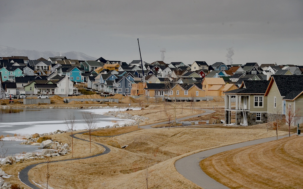 (Francisco Kjolseth  |  Tribune file photo) Ongoing development takes shape around Oquirrh Lake at Daybreak on Thursday, Jan. 9, 2020. Daybreak, the 4,100-acre master planned community in South Jordan, illustrates the idea of blending higher density housing and walkable community design with ample amounts of open space. That "smart growth" land use approach is being required by Salt Lake County for a proposed development called Olympia Hills, a 933-acre residential and commercial project proposed west of Herriman.
