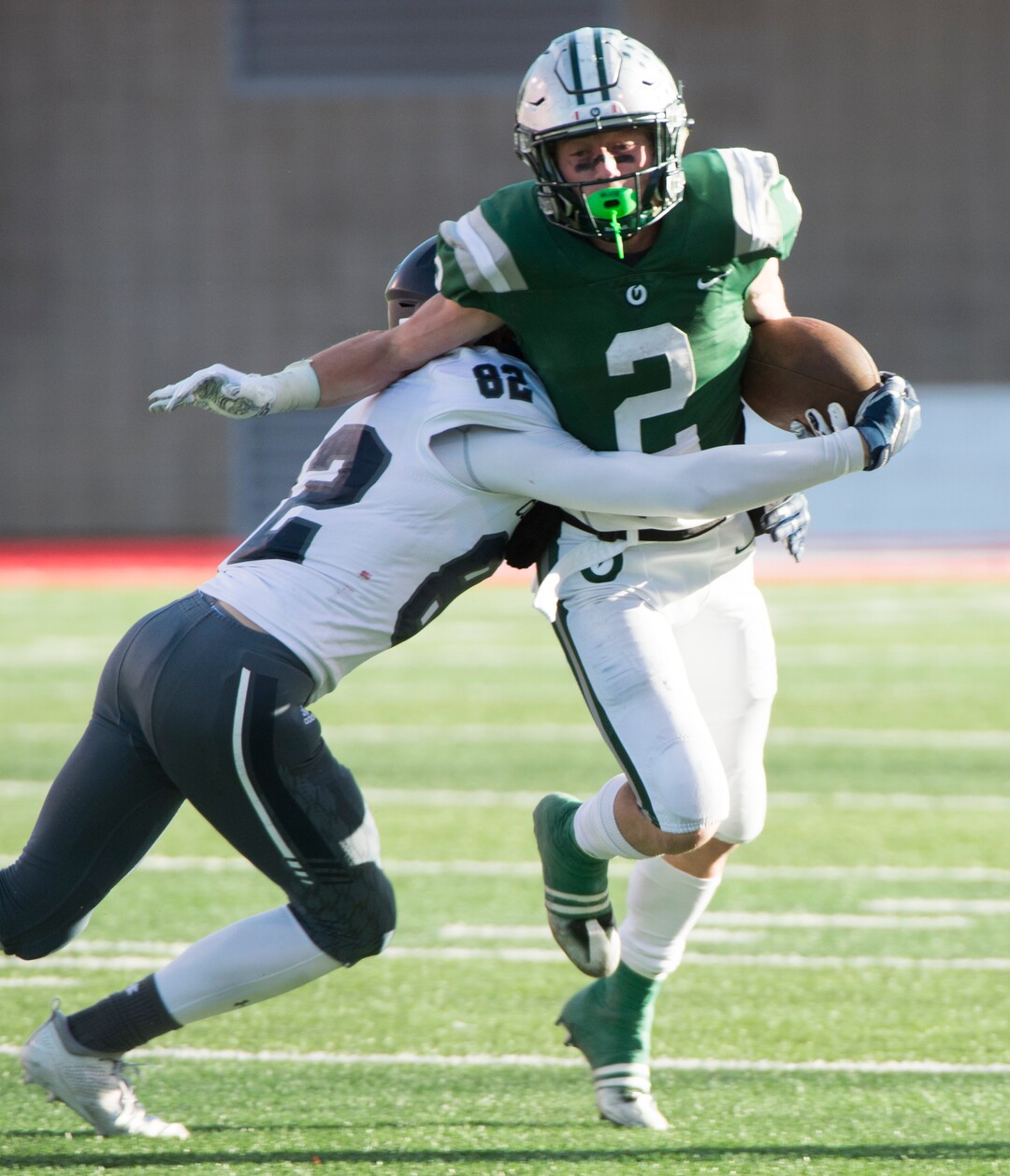 (Rick Egan  |  The Salt Lake Tribune)    Olympus running back Tommy Poulton (2), runs the ball for the Titans, in 5A football semifinal action between Olympus and Corner Canyon at Rice-Eccles Stadium, Thursday, Nov. 8, 2018.