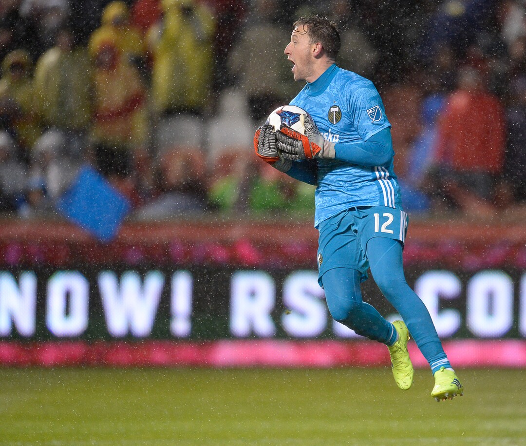 (Francisco Kjolseth  |  The Salt Lake Tribune)  Portland Timbers goalkeeper Steve Clark (12) grabs a goal attempt in driving rain as Real Salt Lake and the Portland Timbers play in their first MLS playoff game at Rio Tinto Stadium in Sandy, Utah on Saturday, Oct. 19, 2019.