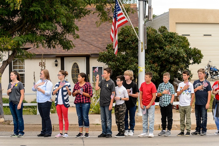 (Trent Nelson | The Salt Lake Tribune)  Crowds line Main Street in Monticello to honor the motorcade of fallen soldier Aaron Butler, who was killed last week in Afghanistan, , Thursday August 24, 2017.