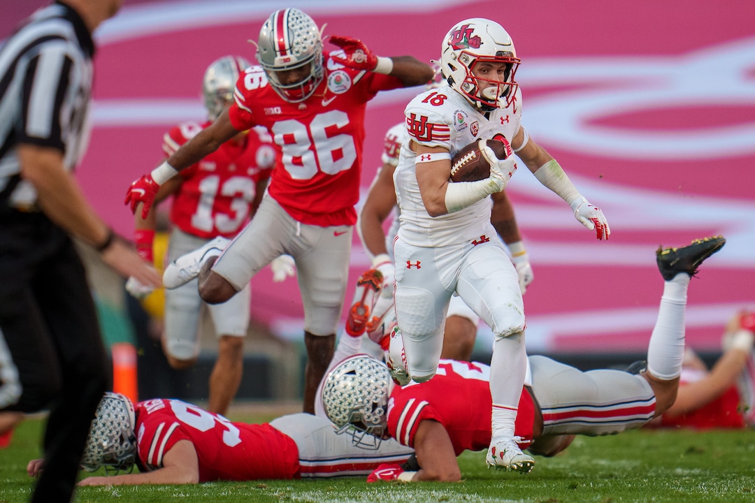 (Trent Nelson  |  The Salt Lake Tribune) Utah Utes wide receiver Britain Covey (18) runs a kick return for a touchdown as the Utah Utes face the Ohio State Buckeyes at the Rose Bowl in Pasadena, Calif., on Saturday, Jan. 1, 2022.