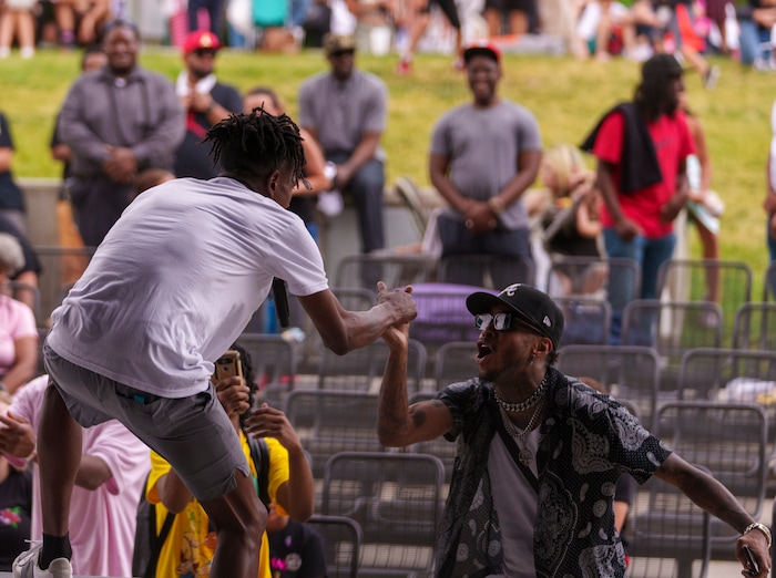 (Leah Hogsten | The Salt Lake Tribune) l-r Rapper MGE Da Goatest shakes hands with Philly rapper Murderous T at the Utah Juneteenth Celebration at the Ogden City Amphitheater, Saturday, June 18, 2022.