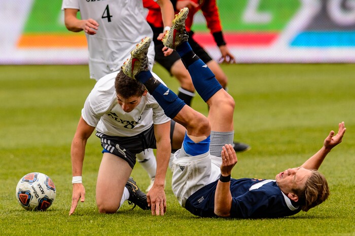 (Trent Nelson  |  The Salt Lake Tribune)  
Olympus's Hayden Earl (8) and Brighton's Chandler Turpin (13) as Olympus faces Brighton High School in the 5A boys state championship game at Rio Tinto Stadium in Sandy, Thursday May 23, 2019.