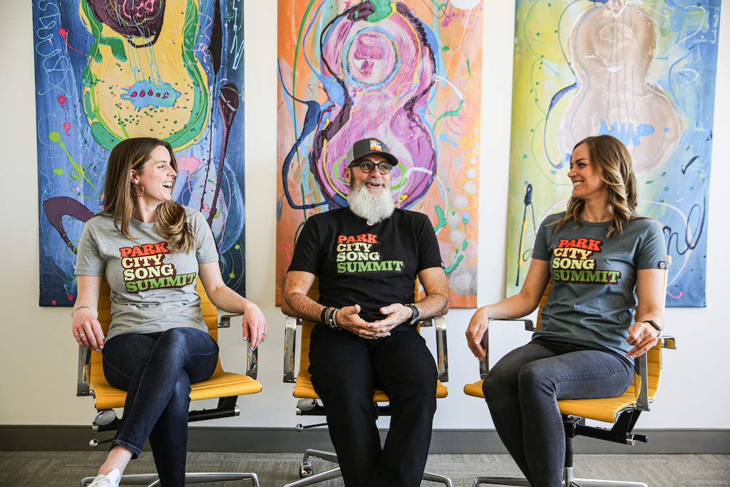 (Blake Peterson | Park City Song Summit) Ben Anderson, center, founder of Park City Song Summit, chats with Julia Stout, left, the summit's director of event operation), and Julia Rametta, director of business operations.