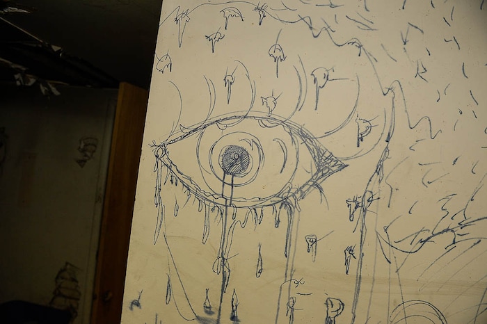 (Trent Nelson | The Salt Lake Tribune) Graffiti in the basement of a dilapidated, fire-damaged building near 100 South 700 East in Salt Lake City, Thursday Feb. 15, 2018. Other Side Academy has received approval to demolish it for their expansion.