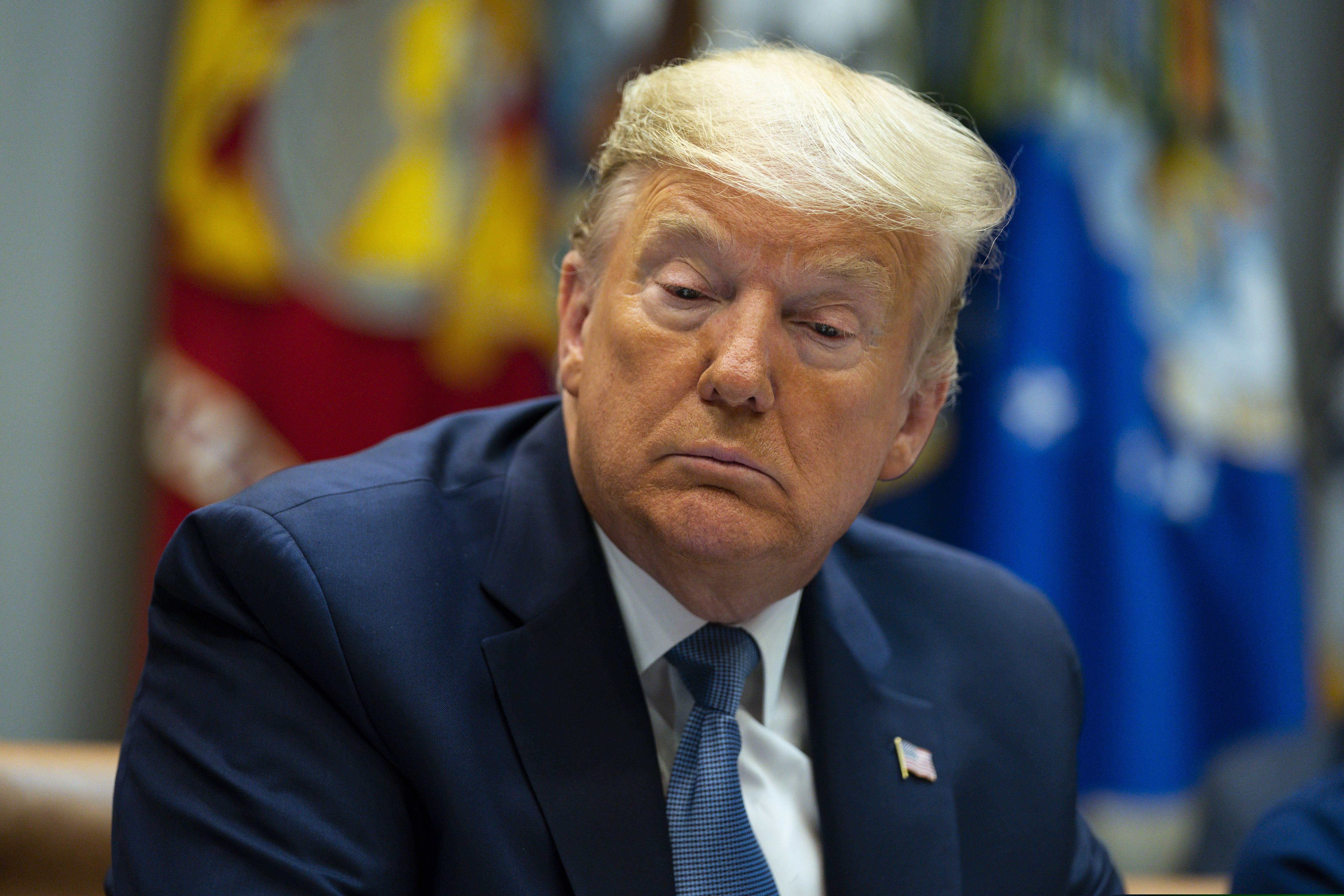 President Donald Trump listens during a meeting on the Coronavirus with health care company leaders, in the Roosevelt Room of the White House, Tuesday, March 10, 2020, in Washington. (AP Photo/Evan Vucci)