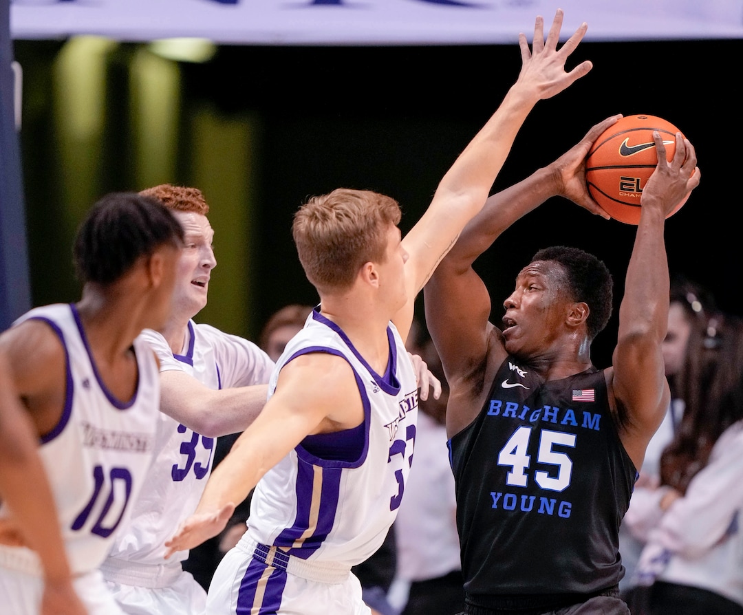 (Francisco Kjolseth | The Salt Lake Tribune) Brigham Young Cougars forward Fousseyni Traore (45) faces a defensive wall in basketball action between the Brigham Young Cougars and the Westminster Griffins at the Marriott Center in Provo, Wednesday, Dec. 29, 2021.