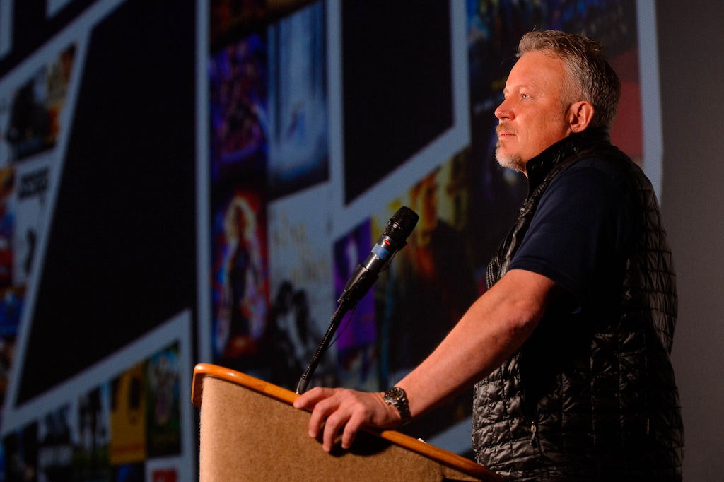 (Trent Nelson  |  The Salt Lake Tribune)Greg Miller speaks about cars and his father, Larry Miller, as Megaplex Theatres celebrates its 20th anniversary at an event at The District location in South Jordan on Thursday Nov. 14, 2019.