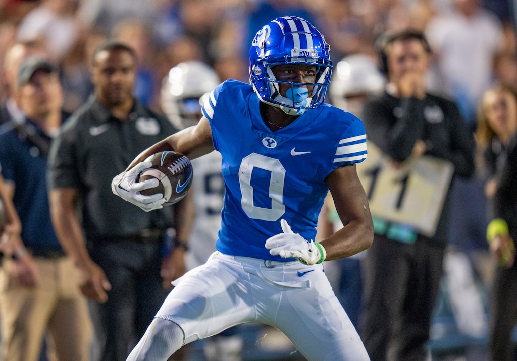 (Rick Egan | The Salt Lake Tribune) Brigham Young Cougars wide receiver Kody Epps (0) runs with the ball, in football action between the Brigham Young Cougars and the Utah State Aggies, at LaVell Edwards Stadium in Provo, on Thursday, Sept. 29, 2022.