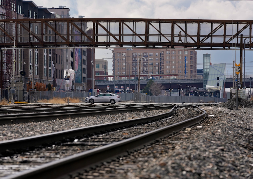 (Francisco Kjolseth | The Salt Lake Tribune) A pedestrian bridge spans the railroad tracks at 300 North in Salt Lake City on Thursday, Feb. 8, 2024, just east of the current freeway underpass at 300 North. UDOT and Salt Lake City have proposed an I-15 underpass at 400 North as a part of the highway's expansion, but residents nearby say they don't want it.