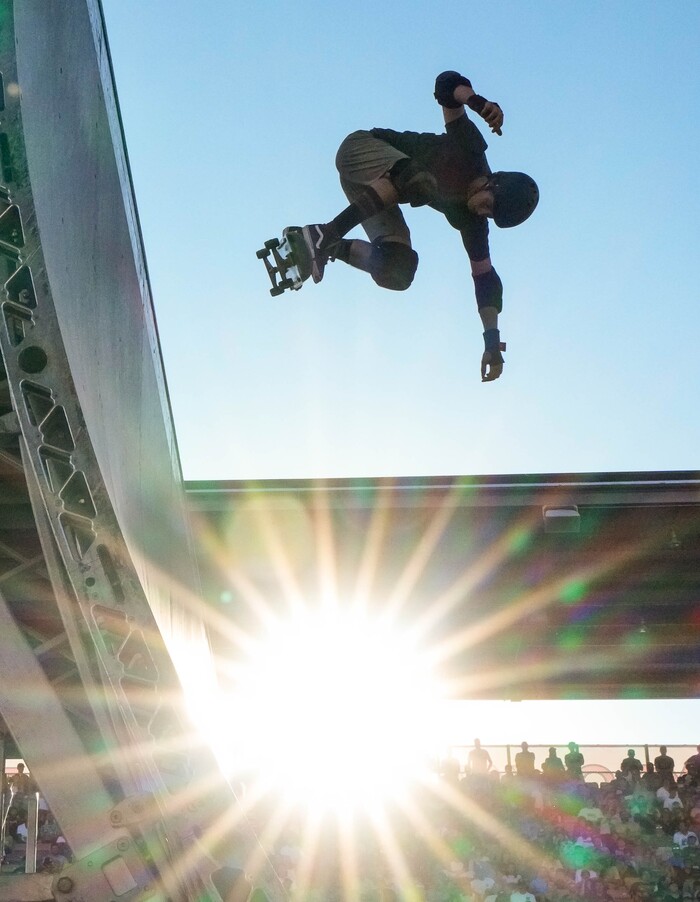 (Francisco Kjolseth | The Salt Lake Tribune) Skaters are silhouetted in the late evening sun during Tony Hawk’s Vert Alert, a big-air skateboarding competition at the Utah Sate Fairpark on Friday, Aug. 26, 2022. 
