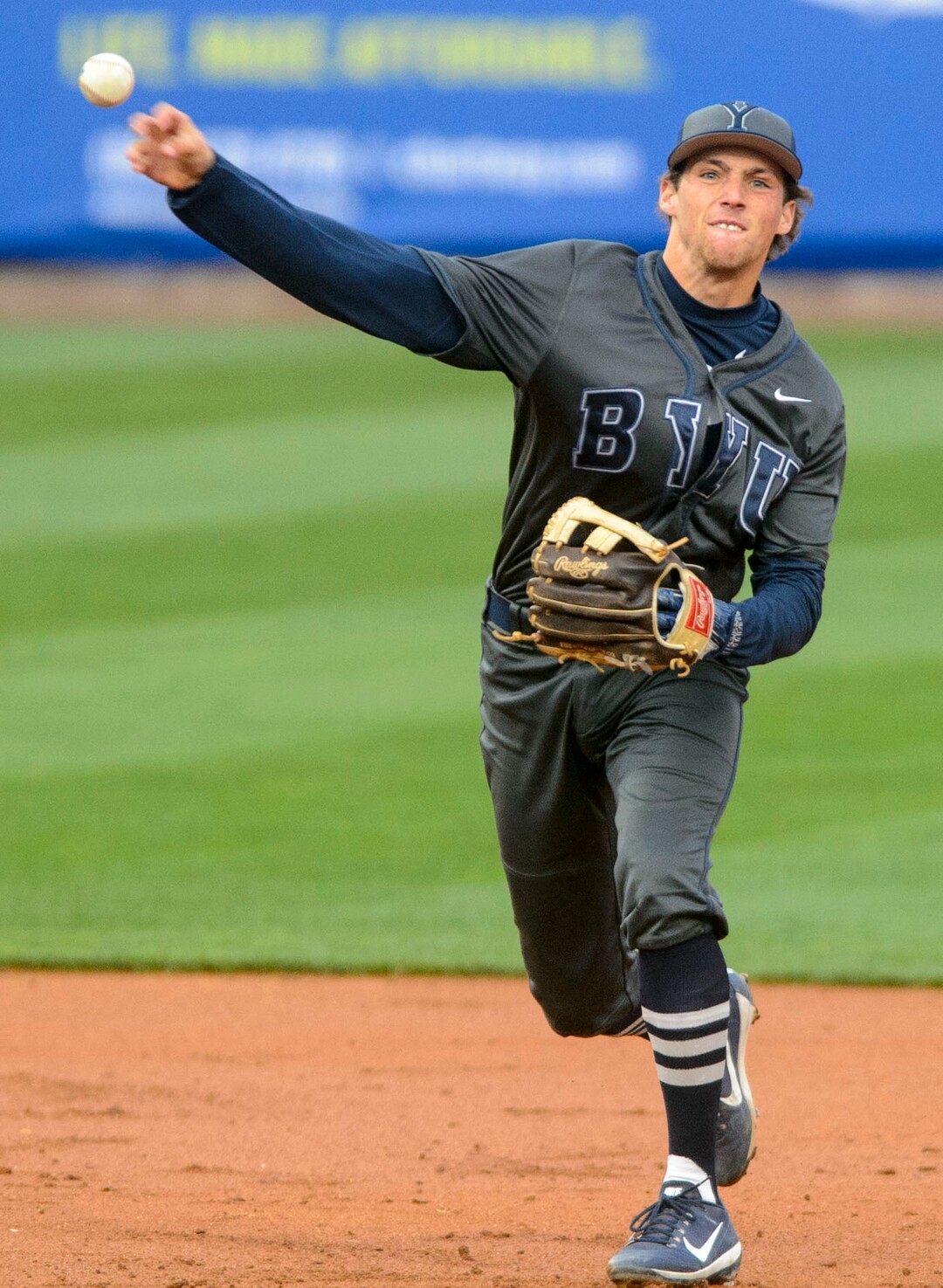(Steve Griffin  |  The Salt Lake Tribune)  BYU shortstop Daniel Schneemann fires to first for an out during the BYU versus Utah baseball game at Smiths Ballpark in Salt Lake City Tuesday April 3, 2018.