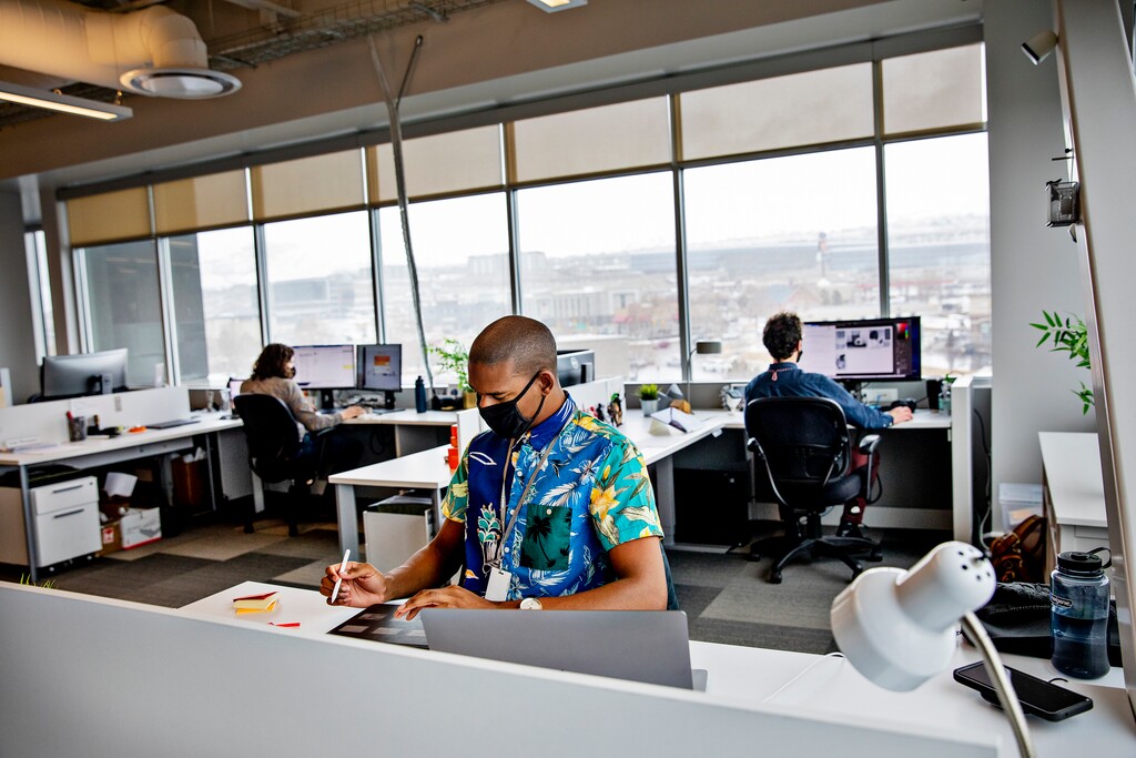 (Kim Raff | The New York Times) Employees with Vivint, a home security business, work at their office in Lehi, Utah, Feb. 16, 2021. As vaccination rates rise, Utah's unemployment rate fell to 2.7% in May, well below the national rate of 5.8%.