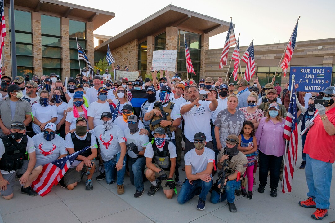 (Leah Hogsten  |  The Salt Lake Tribune) Supporters for Blue Lives Matter and the Cottonwood Heights Police Department pose for a group photo. Five days after after nine protesters were arrested during a peaceful rally in memory of Zane James that turned into a violent clash with Cottonwood Heights officers, demonstrators gathered outside the police station Friday to denounce CHPD's actions and its officers for inciting the violence.