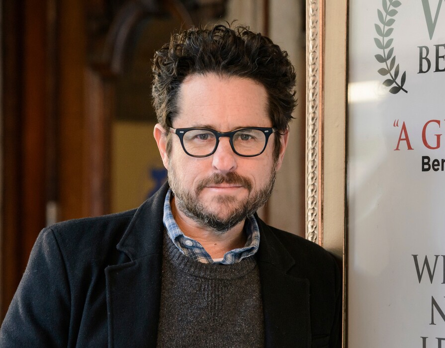FILE - In this March 2, 2017 file photo, director-producer J.J. Abrams poses for a portrait to promote "The Play That Goes Wrong" at the Lyceum Theatre in New York. Abrams is returning to “Star Wars,” and will replace Colin Trevorrow as writer and director of “Episode IX.” Disney announced Abrams return on Tuesday, Sept. 12.  (Photo by Christopher Smith/Invision/AP, File)