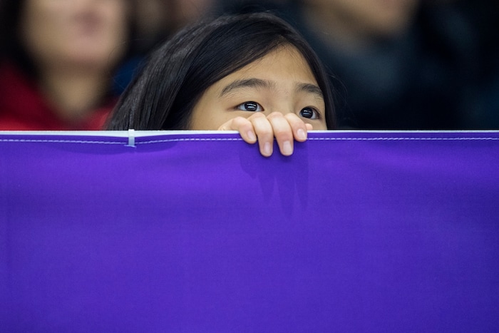 (Chris Detrick  |  The Salt Lake Tribune)  A girl watches the Men's 500m Short Track Speed Skating at Gangneung Ice Arena Pyeongchang 2018 Winter Olympics Tuesday, Feb. 20, 2018. 