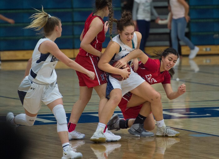 (Scott Sommerdorf | The Salt Lake Tribune)
East's Liana Kaitu'u and Copper Hills' Taela Laufiso grapple for control of a rebound during second half play as Copper Hills defeated East 82-62, Friday, December 29, 2017.