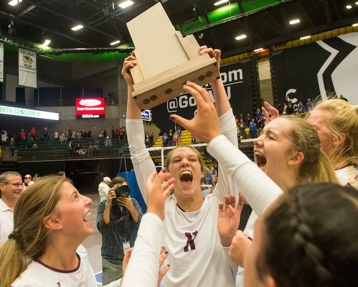 (Rick Egan  |  The Salt Lake Tribune)    The Lone Peak Knights celebrate their win over the Pleasant Grove Vikings, for the 6A volleyball championship, at Utah Valley University, Saturday, November 4, 2017.