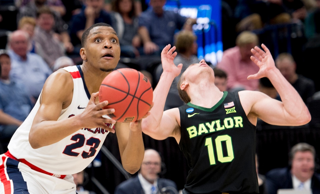 (Leah Hogsten  | The Salt Lake Tribune)  Gonzaga Bulldogs guard Zach Norvell Jr. (23) takes a shot as Baylor Bears guard Makai Mason (10) belatedly reacts to getting hit in the face as Baylor faces Gonzaga in the second round of the NCAA tournament in Salt Lake City on Saturday, March 23, 2019.