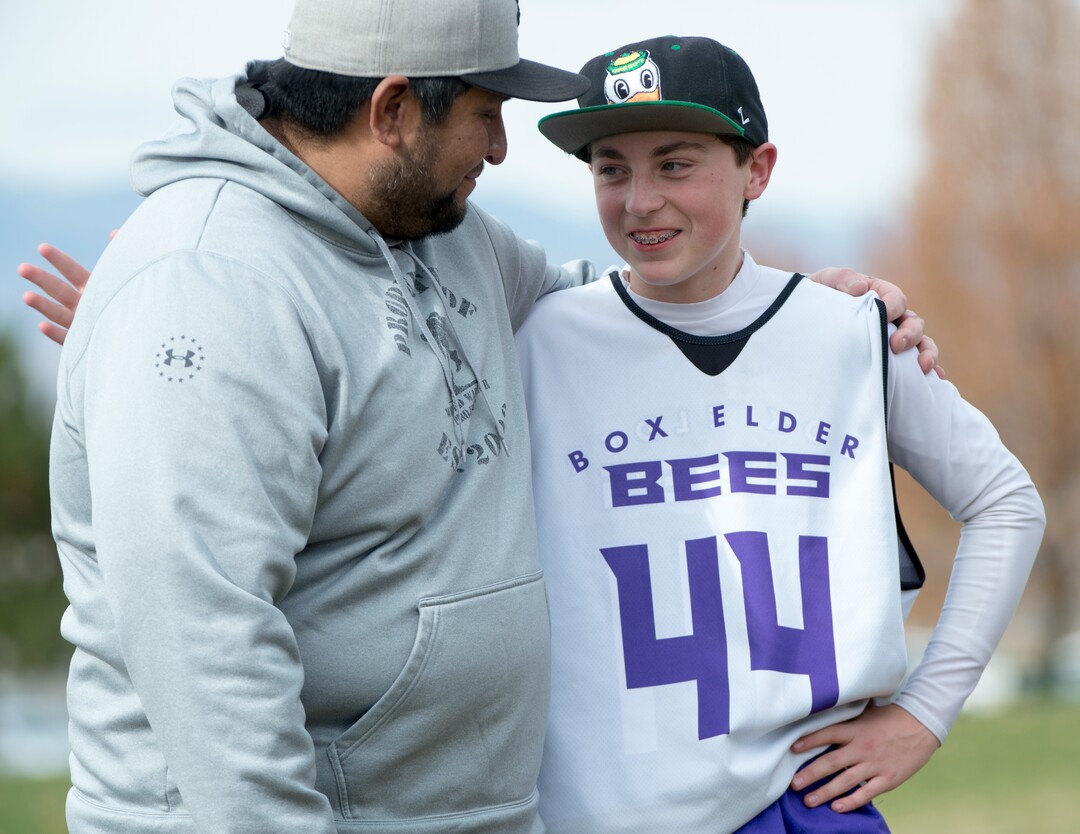(Rick Egan | The Salt Lake Tribune) Player Seth Linvulle gets a hug from Box Elder lacrosse coach Juan Gaytan during a tournament in Logan on Saturday, Nov. 3, 2018.