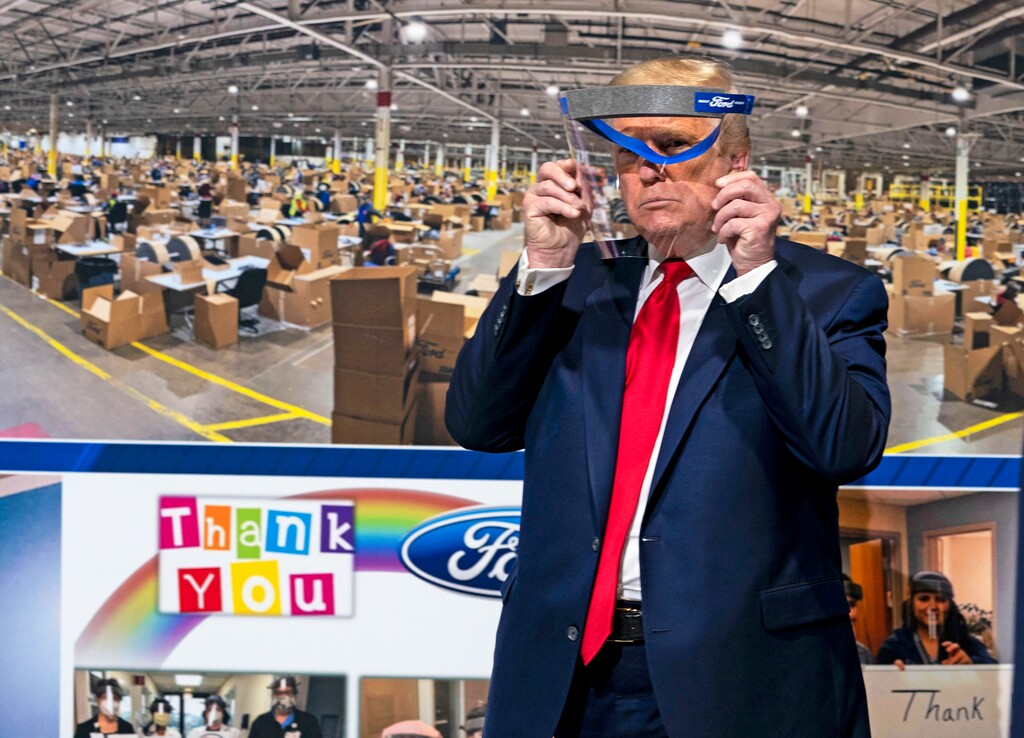 (Doug Mills | The New York Times)
President Donald Trump displays a face shield made at Ford's Rawsonville Components Plant in Ypsilanti, Mich., during his visit to the plant on Thursday, May 21, 2020. "The Trump carnival of dread, with its twin fixations on masks and unmasking, is all too real," writes Maureen Dowd.