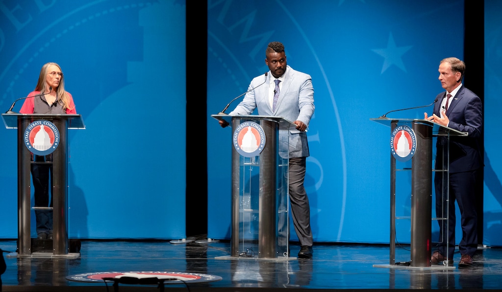 (Asher Swan | Pool) From left, Cassie Easley and Nick Mitchell watch as Rep. Chris Stewart make remarks during the 2nd Congressional District debate in Cedar City, Friday, Oct. 14, 2022.