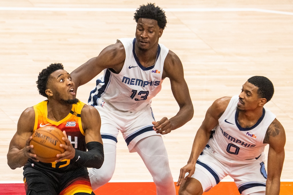 (Rick Egan | The Salt Lake Tribune) Utah Jazz guard Donovan Mitchell (45) looks for a shot, as Memphis Grizzlies forward Jaren Jackson Jr. (13) and Memphis Grizzlies guard De'Anthony Melton (0)  defend, in NBA Playoff game 2, between the Utah Jazz and the Memphis Grizzlies at Vivint Arena, on Wednesday, May 26, 2021.