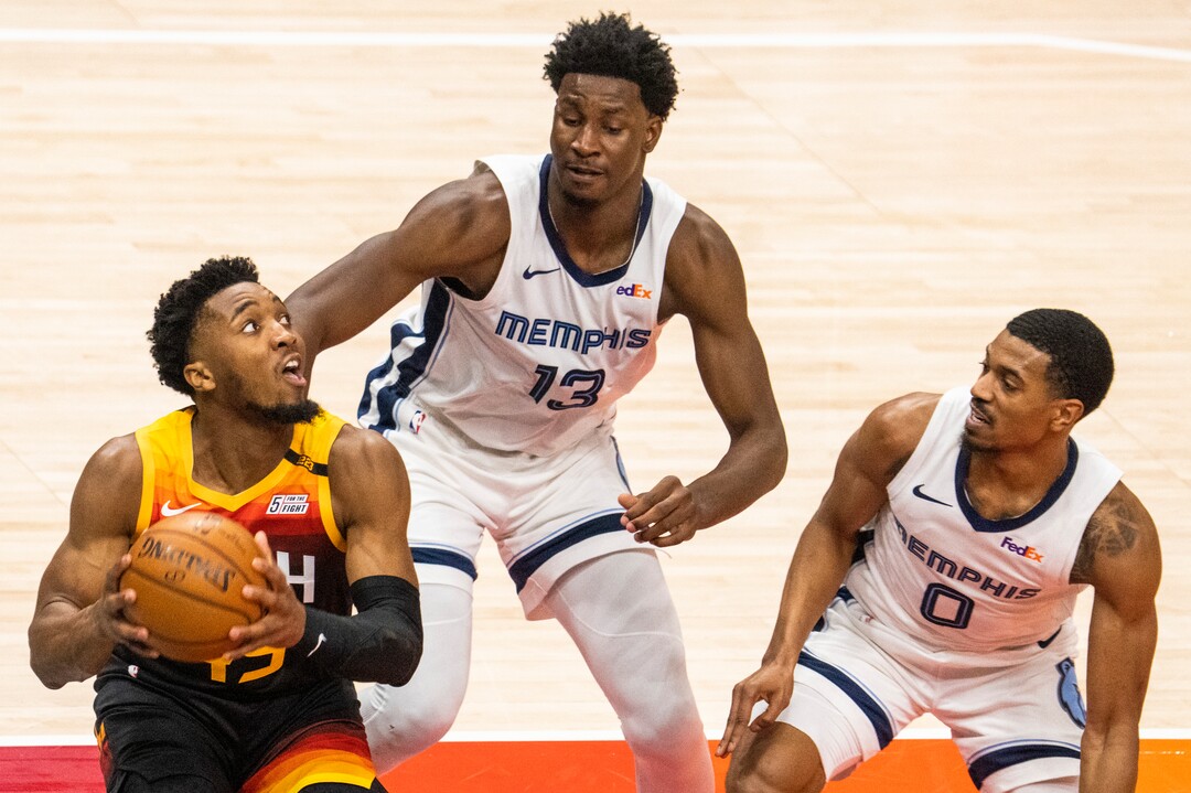 (Rick Egan | The Salt Lake Tribune) Utah Jazz guard Donovan Mitchell (45) looks for a shot, as Memphis Grizzlies forward Jaren Jackson Jr. (13) and Memphis Grizzlies guard De'Anthony Melton (0)  defend, in NBA Playoff game 2, between the Utah Jazz and the Memphis Grizzlies at Vivint Arena, on Wednesday, May 26, 2021.